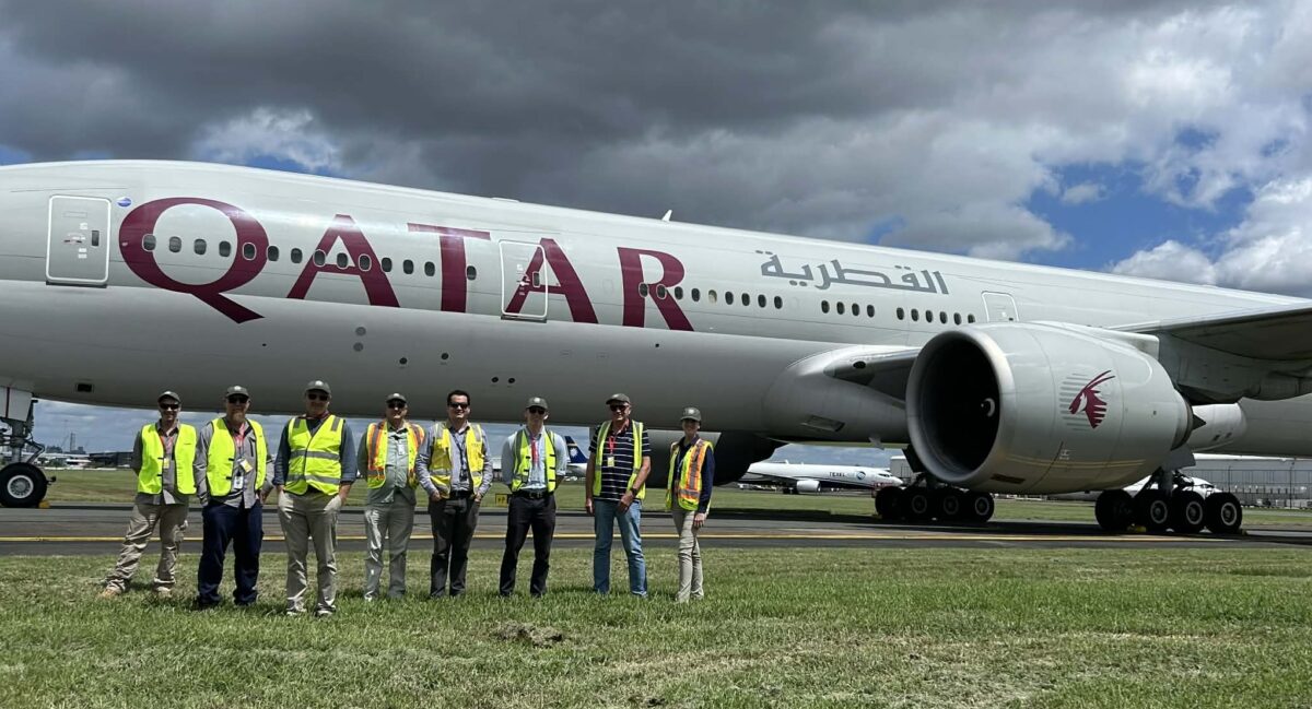 IMCG group in front of Qatar plane scaled